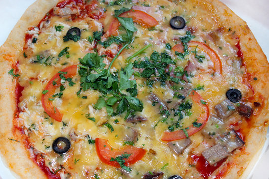 pizza tasty with olives and tomatos