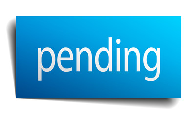 pending blue paper sign on white background