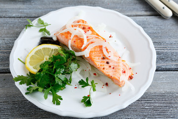 Grilled salmon on a white plate