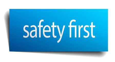 safety first blue paper sign isolated on white