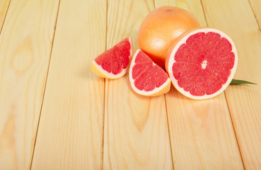 Grapefruits segments on a wooden table