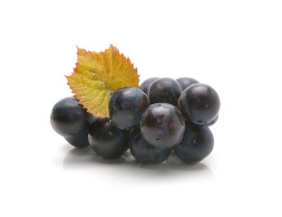 Red grape with green leaf isolated on white background