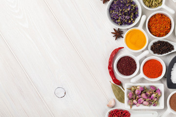 Various spices on wooden background
