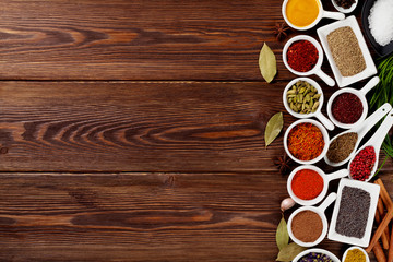Various spices on wooden background