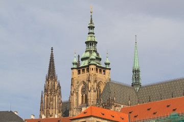 Fototapeta na wymiar Ancient roofs of Prague. St. Vitus Cathedral, Czech Republic