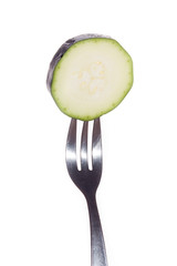 green zucchini on a white background - obrazy, fototapety, plakaty