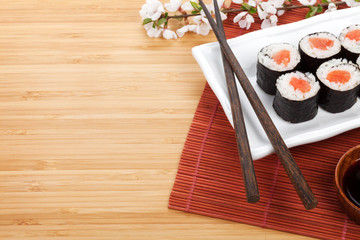 Sushi maki set and sakura branch