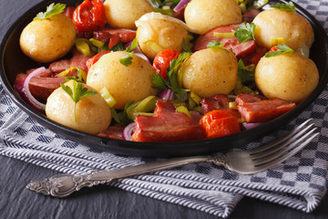 Appetizing new potatoes with bacon and herbs, horizontal 