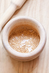 Close-up view of organic Gomasio in a ceramic bowl