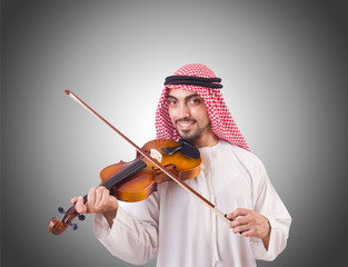 Arab man playing music on white