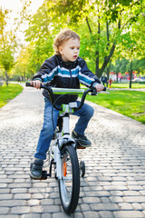 Cute kid riding a bicycle