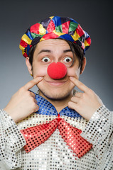 Funny clown against dark background
