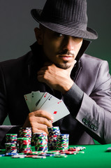 Man playing in dark casino