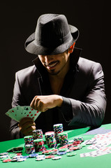 Man playing in dark casino