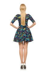 Woman in dark blue floral dress isolated on white