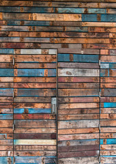 Background of wall and door made of wooden planks