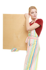 housewife holds wooden board with copy space
