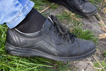 black shoes on the leg