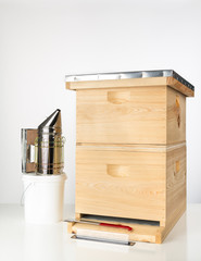 Langstroth beehive with smoker, trap, pail, etc.