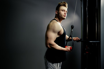 strong bodybuilder athlete works out and pushing trainer