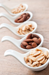 peanut and almond in spoons
