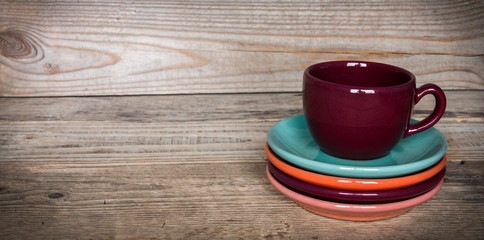 set of colorful cups and dishes and dessert