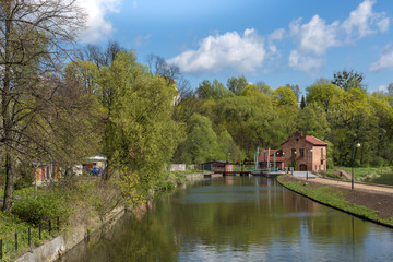 Fototapeta na wymiar Old water mill and dam in Lidzbark Warminski