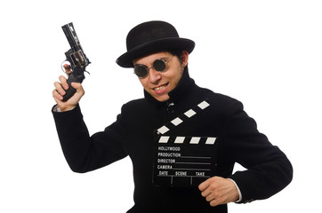 Fototapeta na wymiar Young man with gun and clapper-board isolated on white