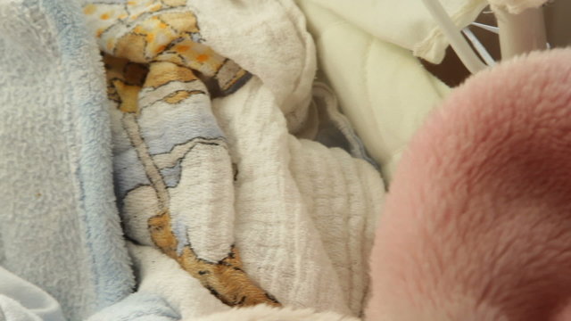 little newborn baby girl sleeping. Full HD motorized slider