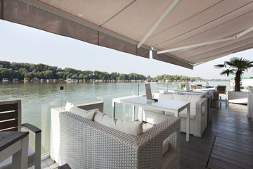 Modern riverside cafe terrace