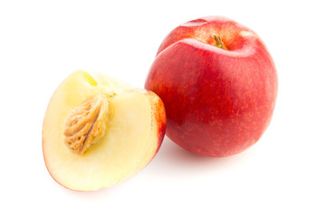 White nectarine whole and sliced over white