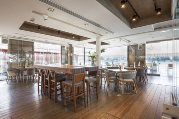 Fototapeta na wymiar Interior of an elegant riverside cafe