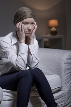 Woman wearing scarf after chemotherapy