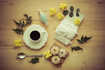 Coffe cup, cookies, yellow flowers and old lace