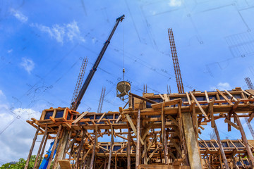 Fototapeta na wymiar Crane working in construction on blue sky