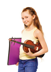 Fototapeta premium Small girl holding purple folder and violin