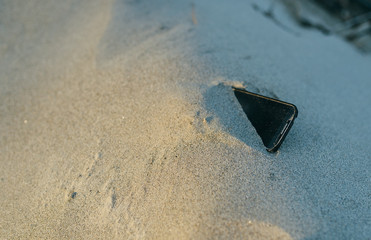 Smartphone lost in the sand