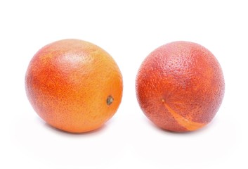 Blood red oranges isolated on white background