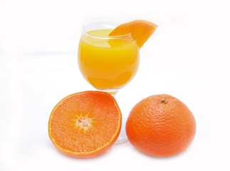 Tangerines and juice glass isolated on white background