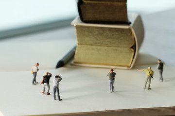 Creative idea concept - miniature photographer with vintage gold