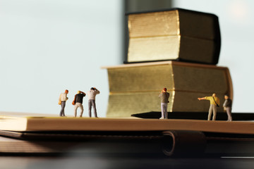 Creative idea concept - miniature photographer with vintage gold