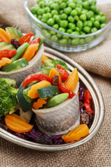 Pickled herring rolls with vegetables