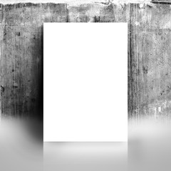 Blank White Poster Mock Up Leaning on Grunge Studio Wall