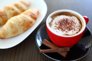 Italian cappuccino and croissant