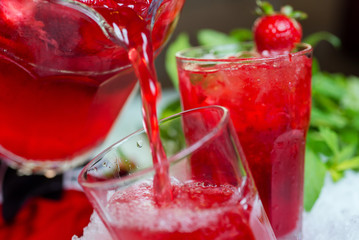 a decanter of bright summer cool refreshing strawberry lemonade