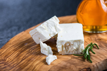 Feta cheese on wooden board
