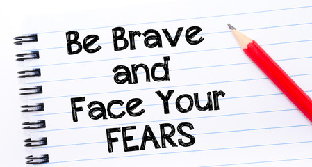 Fototapeta premium Be Brave and Face Your Fears Text written on notebook page