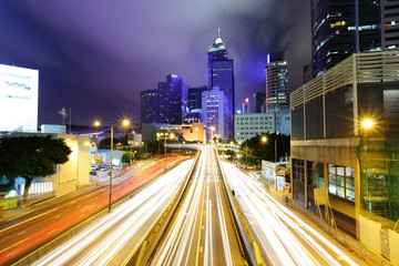 Fototapeta na wymiar Car light trails and urban landscape in Hong Kong