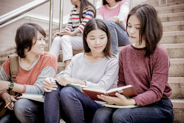 group of happy teen high school students outdoors