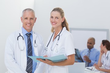 Fototapeta premium Team of doctors working on their files